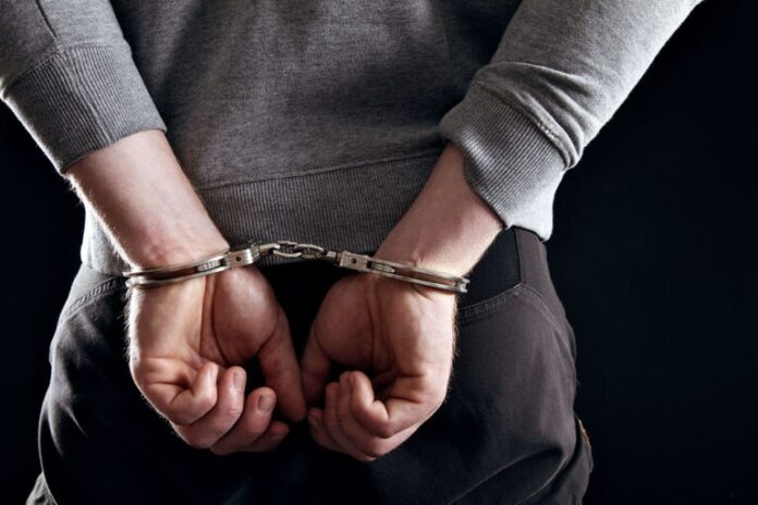 hands-locked-in-handcuffs-felony.jpg